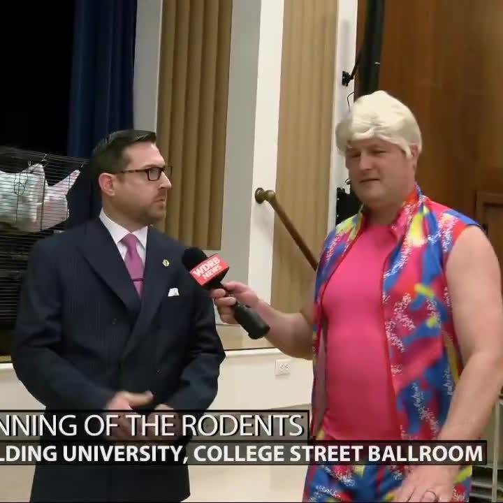 Spalding University officials explain 'Run for the Rodents' to Keith Kaiser